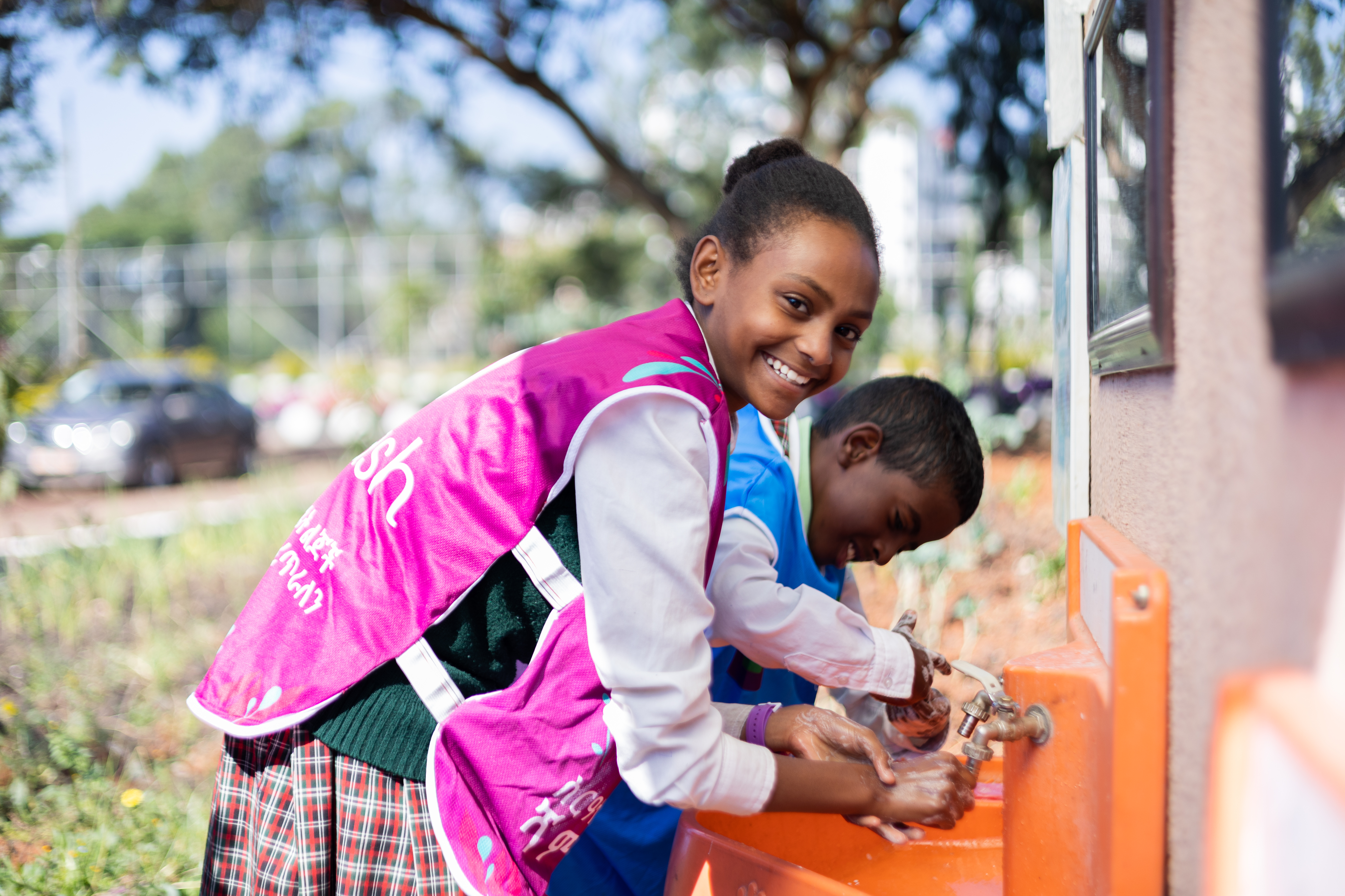 Ethiopian students cheering in a school courtyard